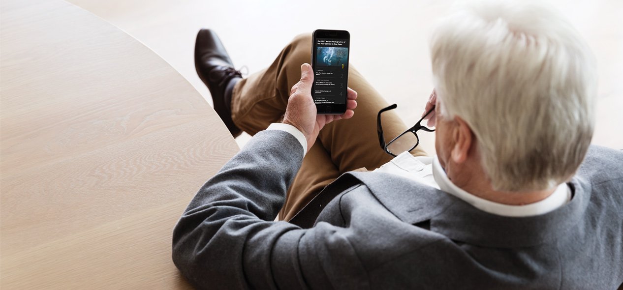 Senior man using smartphone app