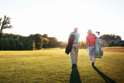 Senior couple playing golf. Pavilions Blackburn Lake is near four major golf courses